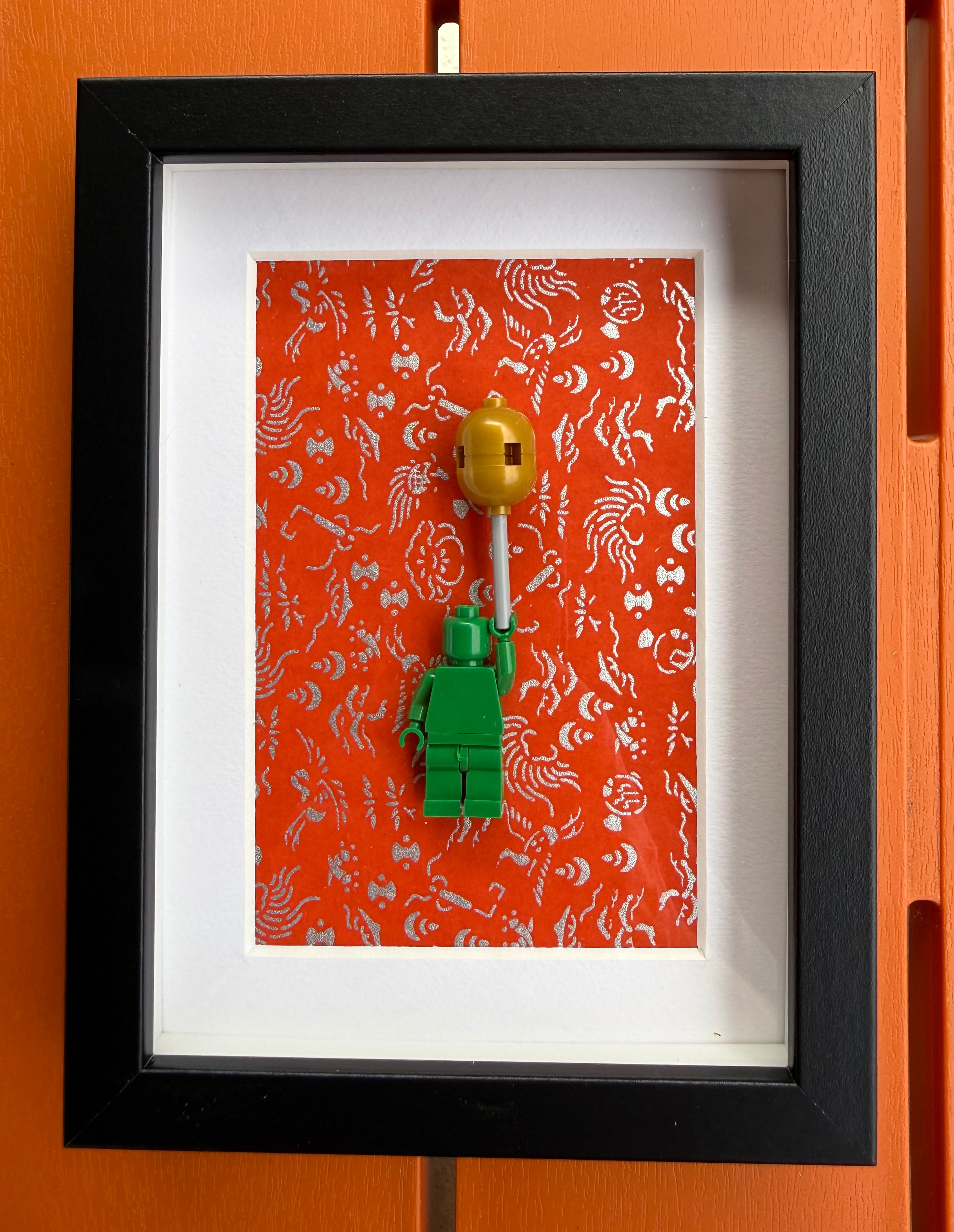 FRAMED GREEN BRICK FIGURE WITH BALLOON
