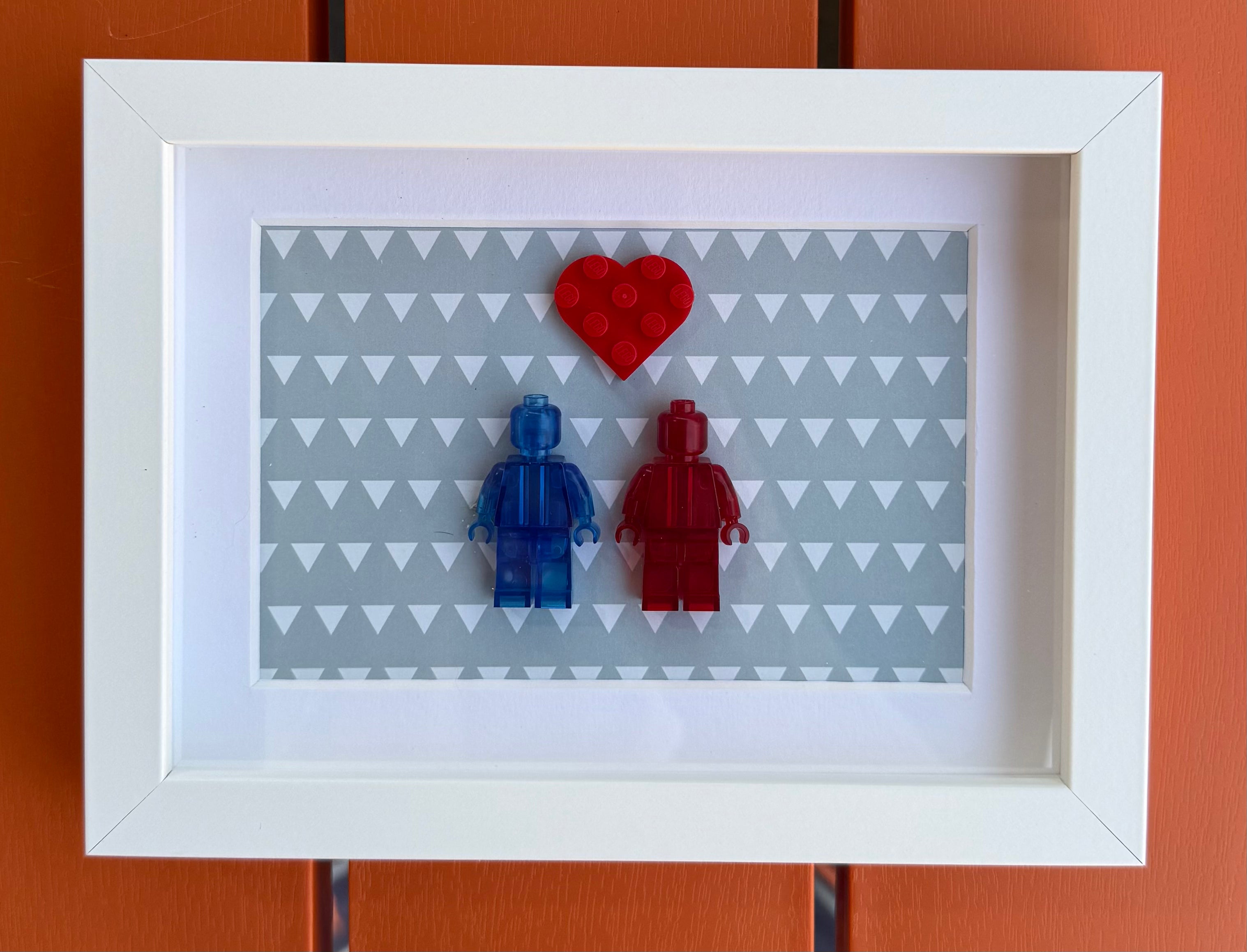 FRAMED BLUE & RED BRICK FIGURE COUPLE WITH HEART