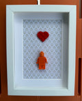 FRAMED ORANGE BRICK FIGURE WITH HEART