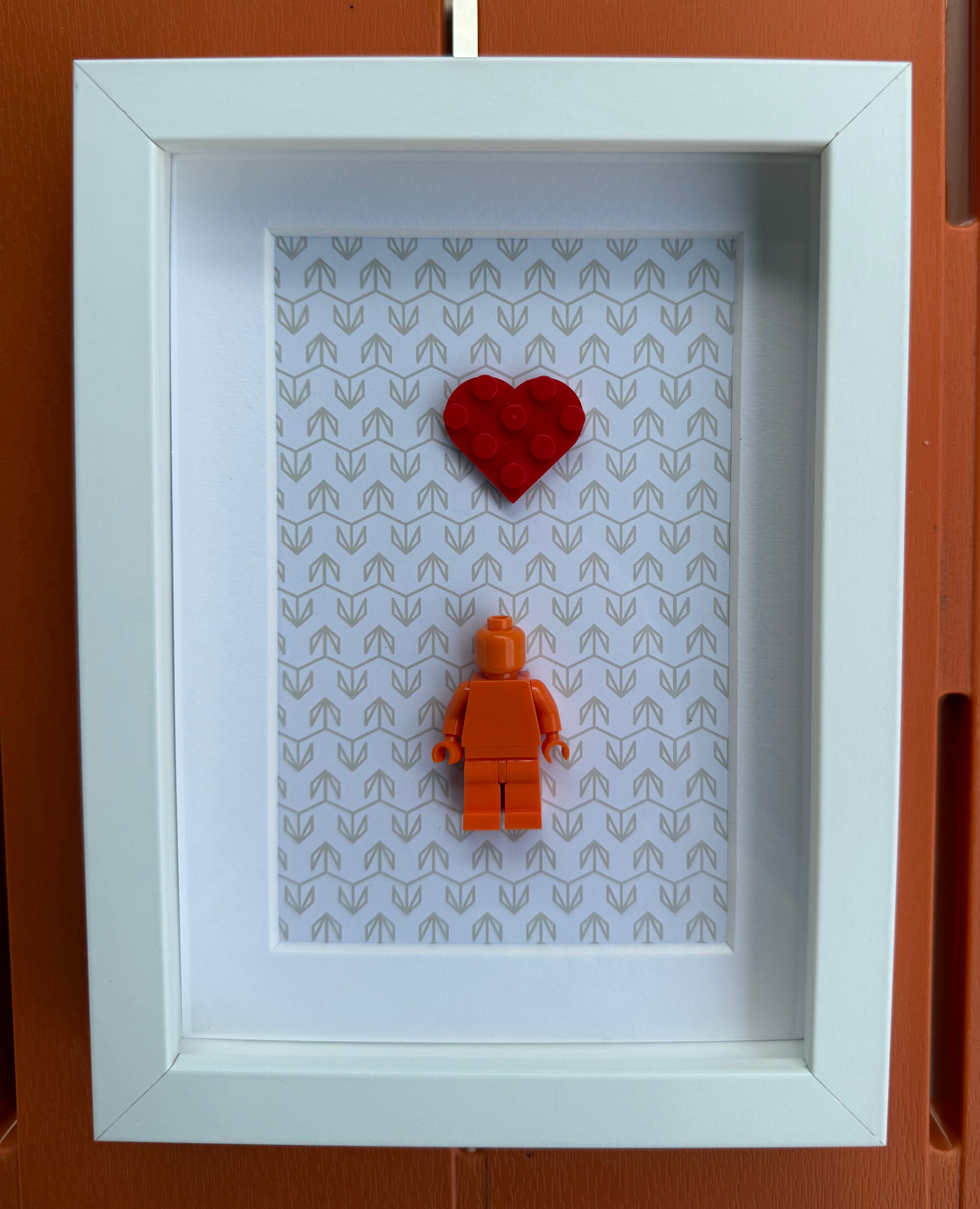FRAMED ORANGE BRICK FIGURE WITH HEART