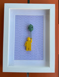 FRAMED YELLOW BRICK FIGURE WITH BALLOON