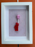 FRAMED RED BRICK FIGURE WITH BALLOON