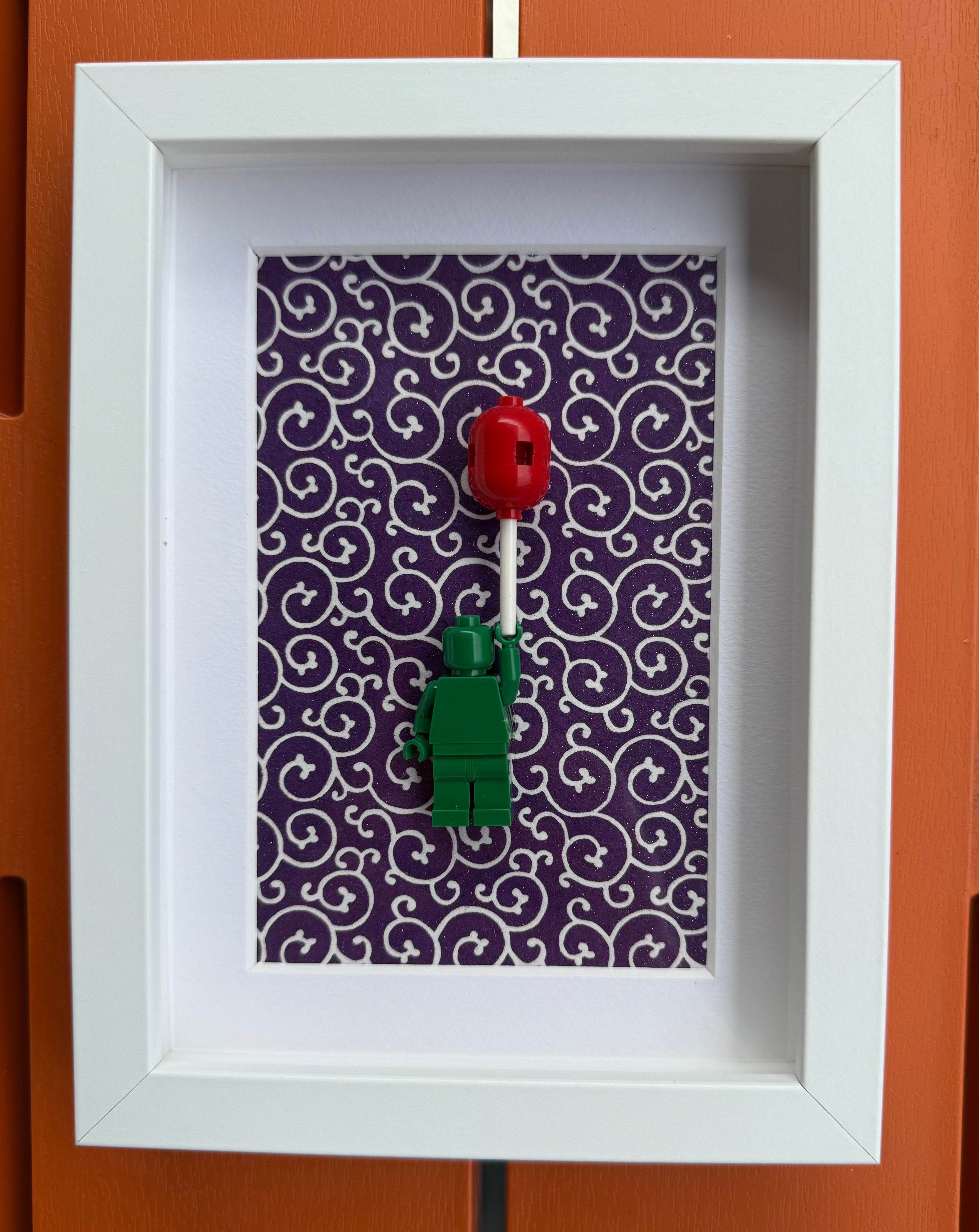 FRAMED GREEN BRICK FIGURE WITH BALLOON