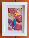FRAMED BLUE BRICK FIGURE WITH BALLOON