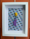 FRAMED PURPLE BRICK FIGURE WITH BALLOON
