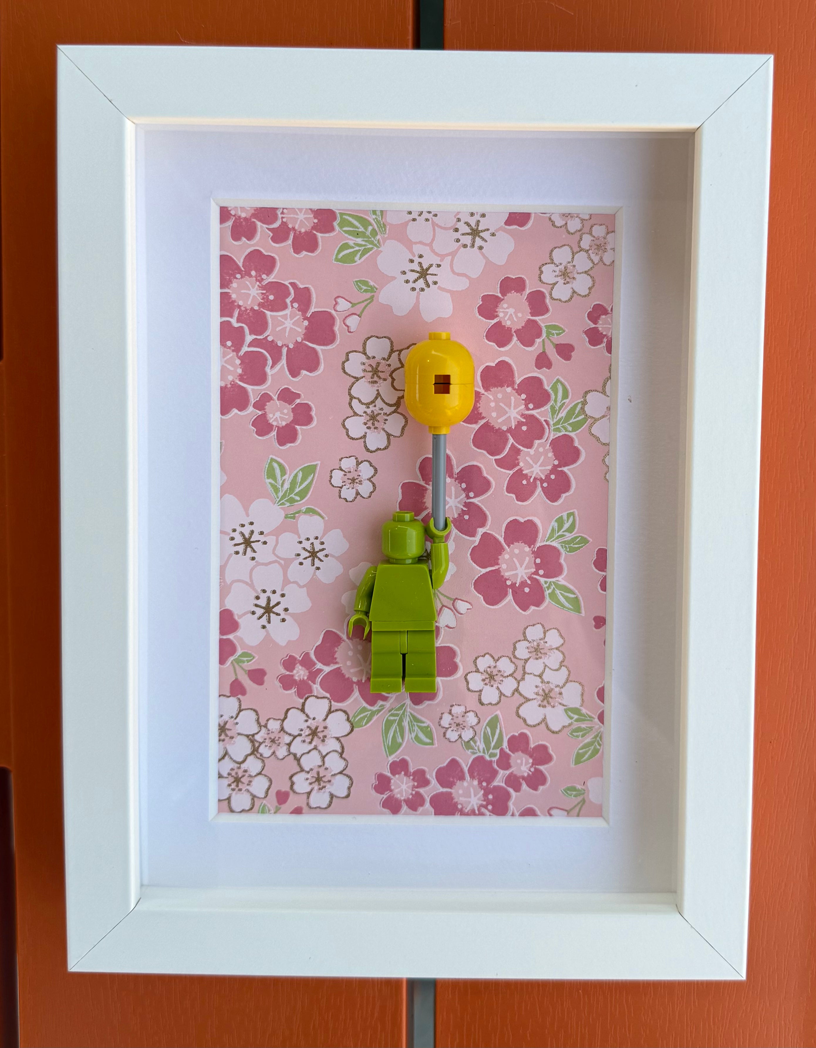 FRAMED GREEN BRICK FIGURE WITH BALLOON