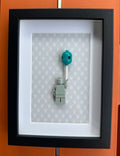 FRAMED GREY BRICK FIGURE WITH BALLOON