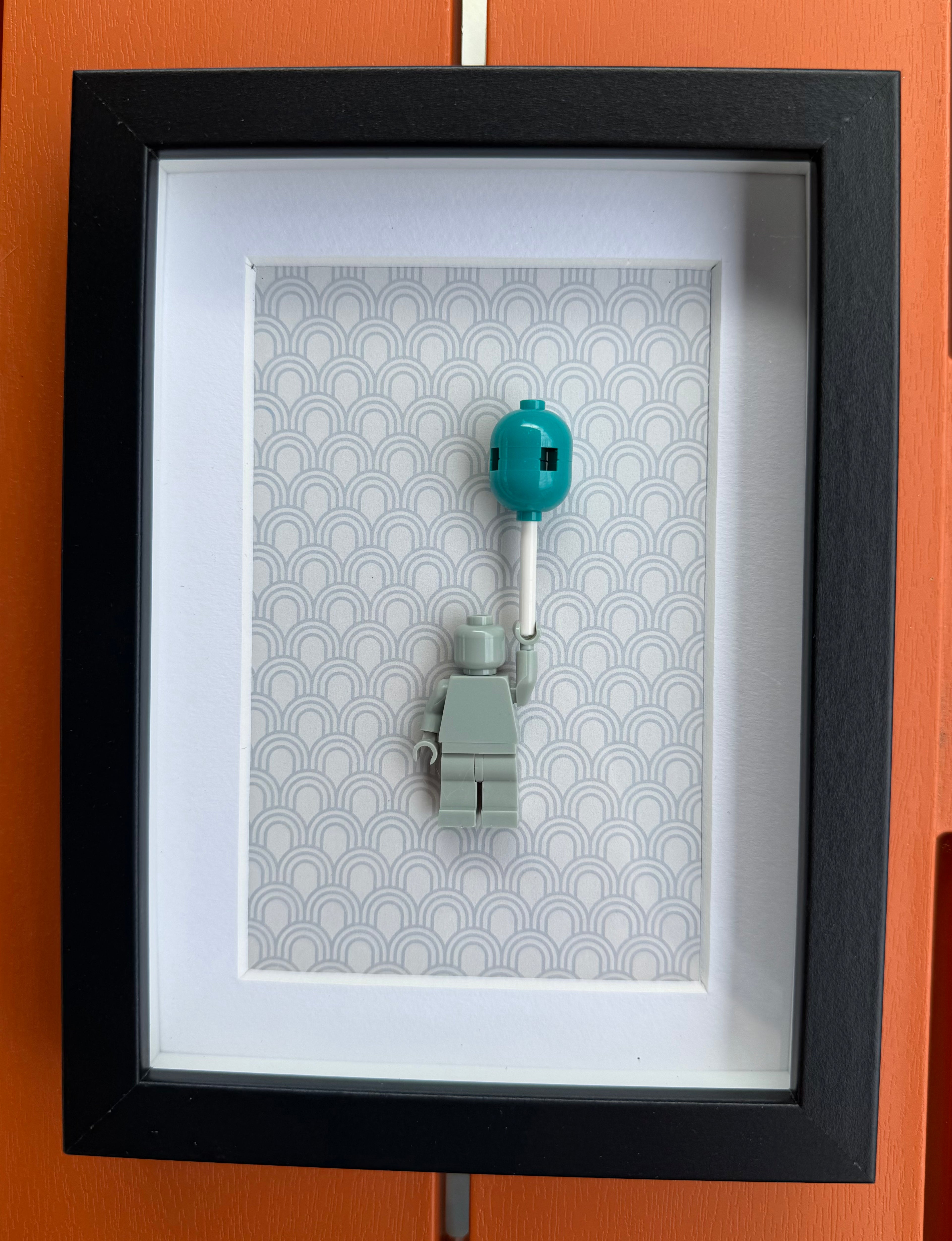 FRAMED GREY BRICK FIGURE WITH BALLOON