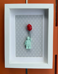 FRAMED LIGHT BLUE BRICK FIGURE WITH BALLOON